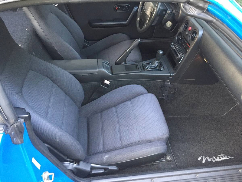 Illustration for article titled Could This Ultra-Low Mileage 1990 Mazda Miata be Worth $6,999?